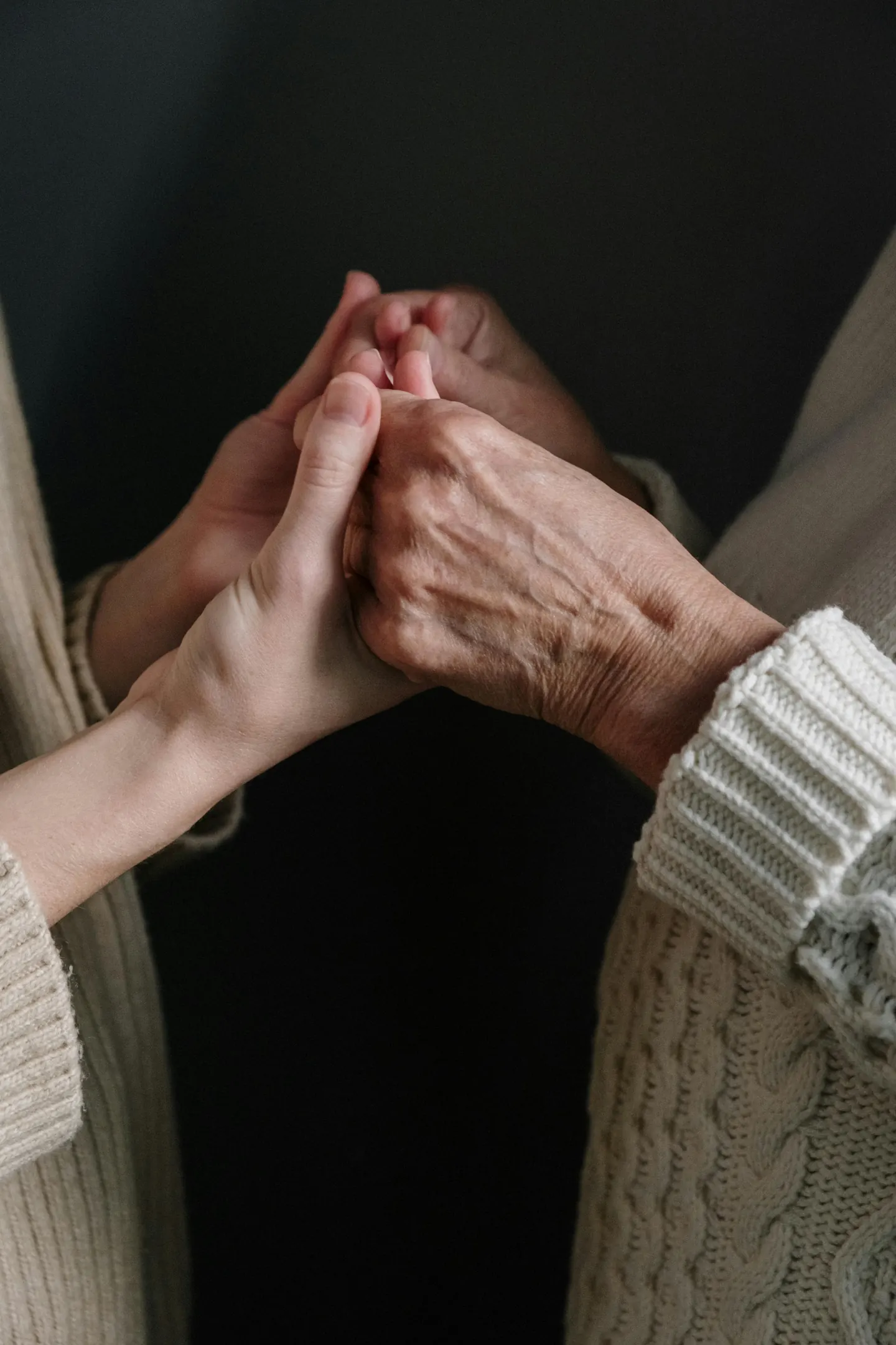Two people clasping hands
