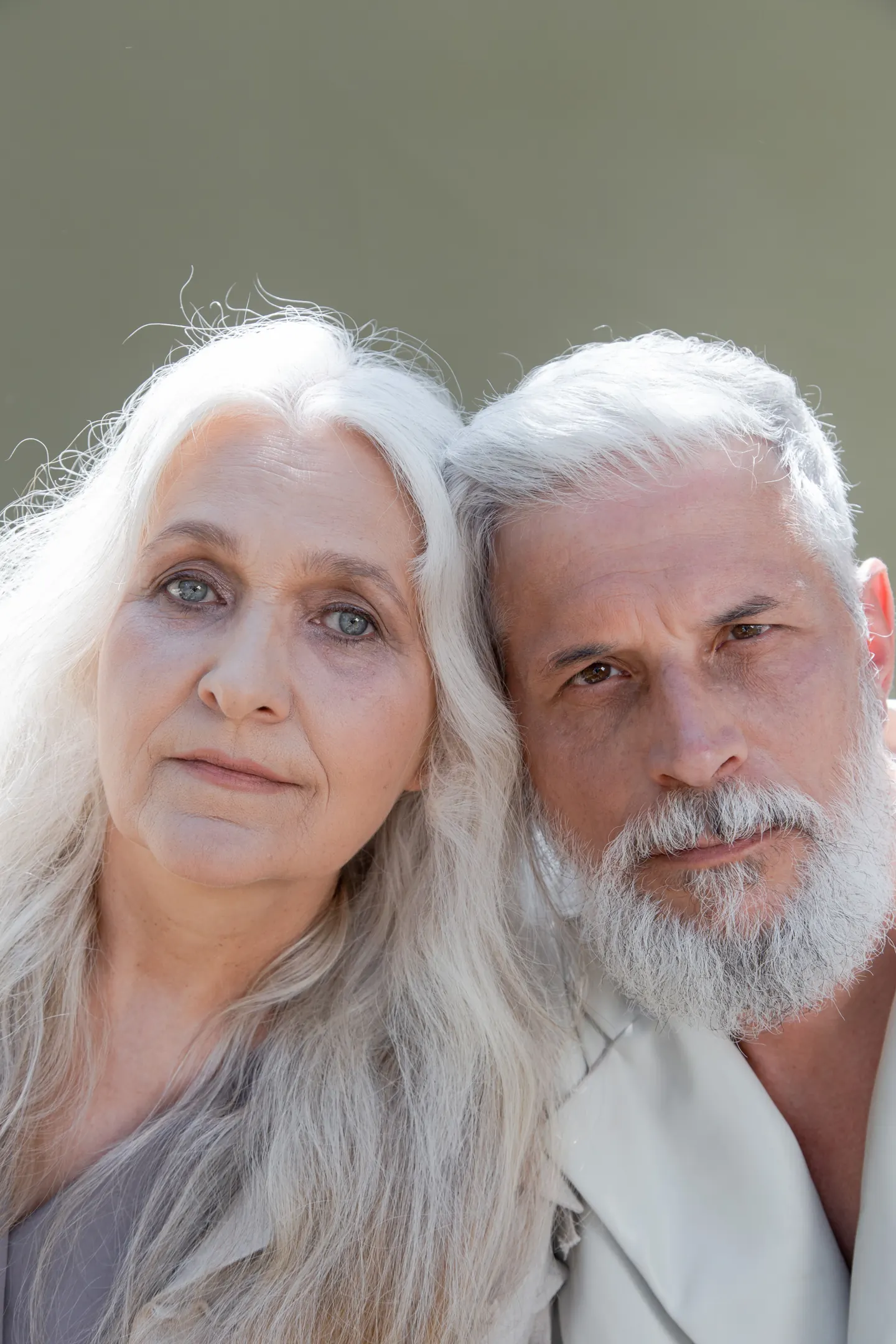 An older couple leaning close together